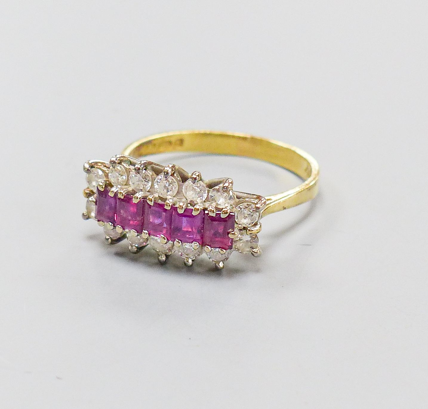 A modern 18ct gold, ruby and diamond half hoop cluster ring, size Q, gross weight 4.5 grams.